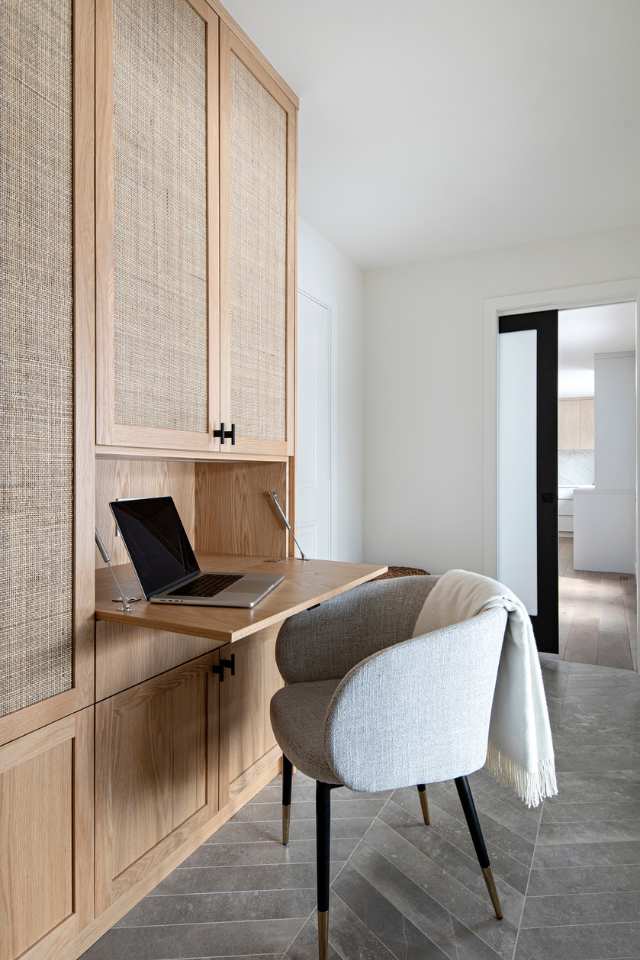 dual purpose desk set up in entryway of home in wicker wooden cabinet